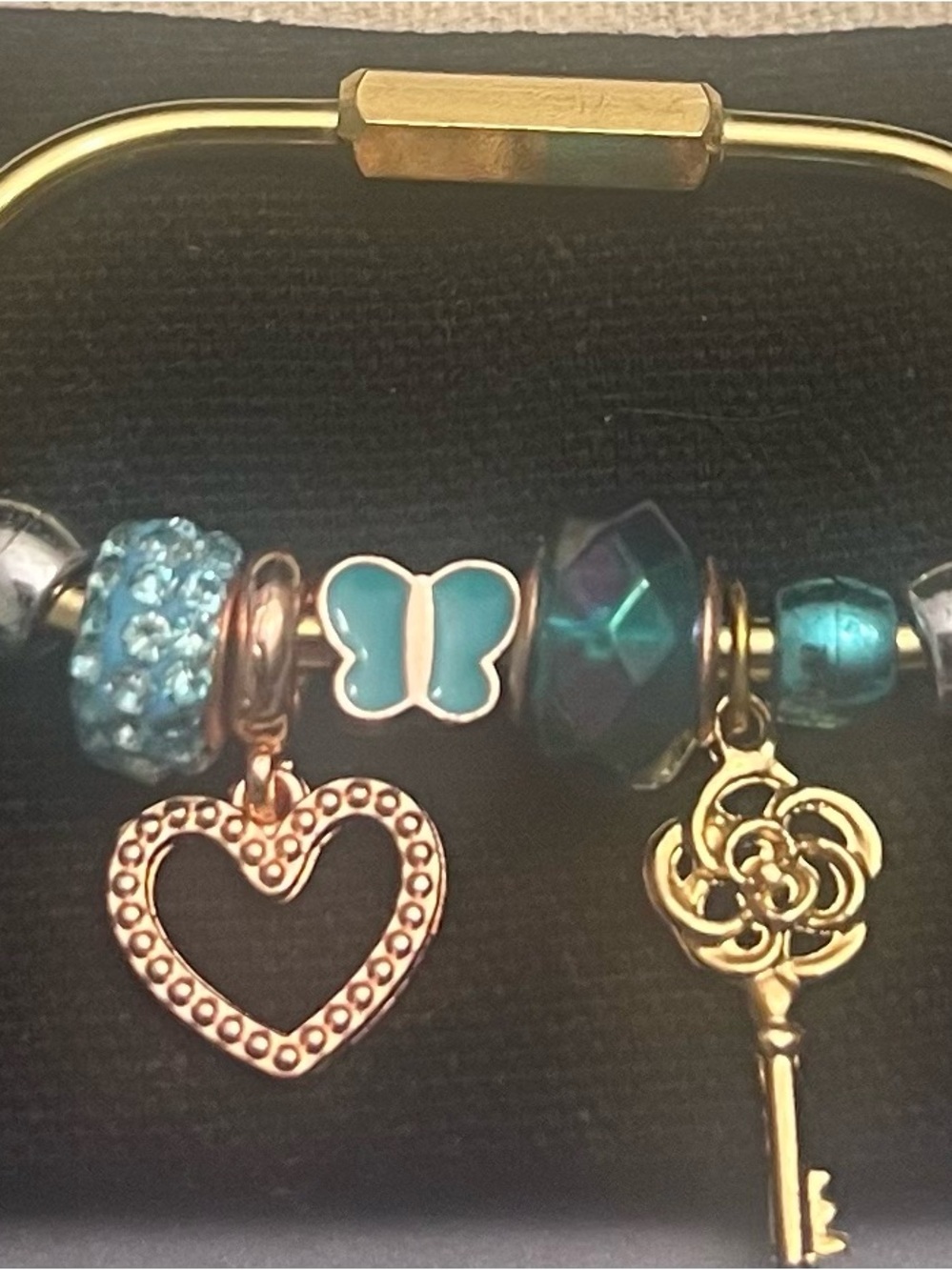 Gold-Tone bag charm with Teal Butterfly and Heart Charms